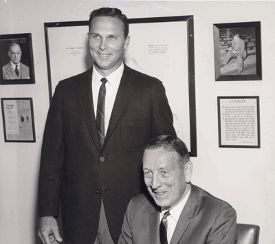 Brain trust. Coach Wooden (seated) and Asst. Coach Norman made college basketball history. (Photo courtesy ASUCLA Photography)