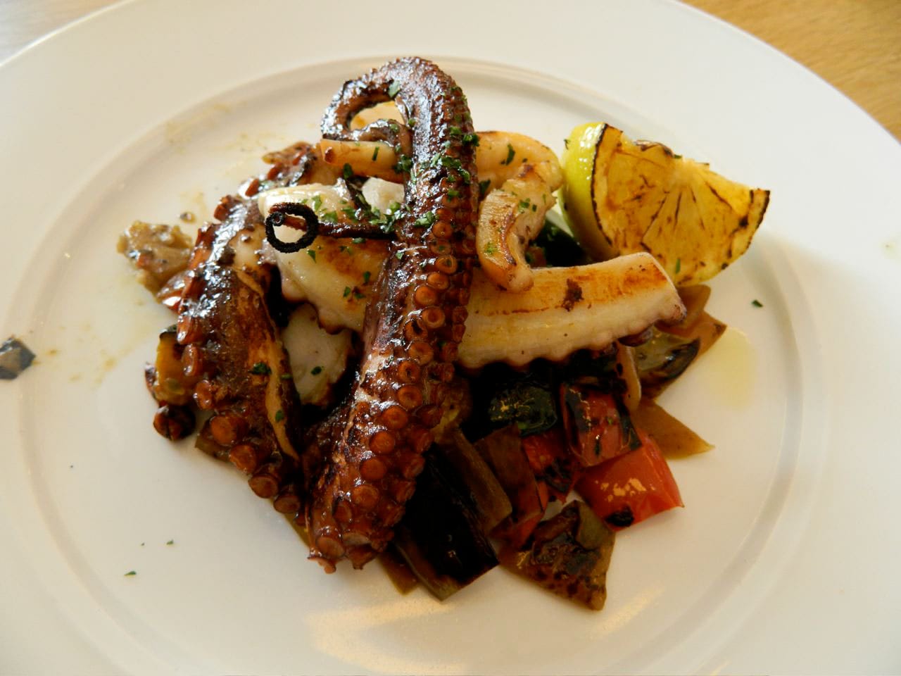 The perfectly grilled octopus with charred vegetables and seared lemon. (John Blanchette editor@www.smdp.com) 