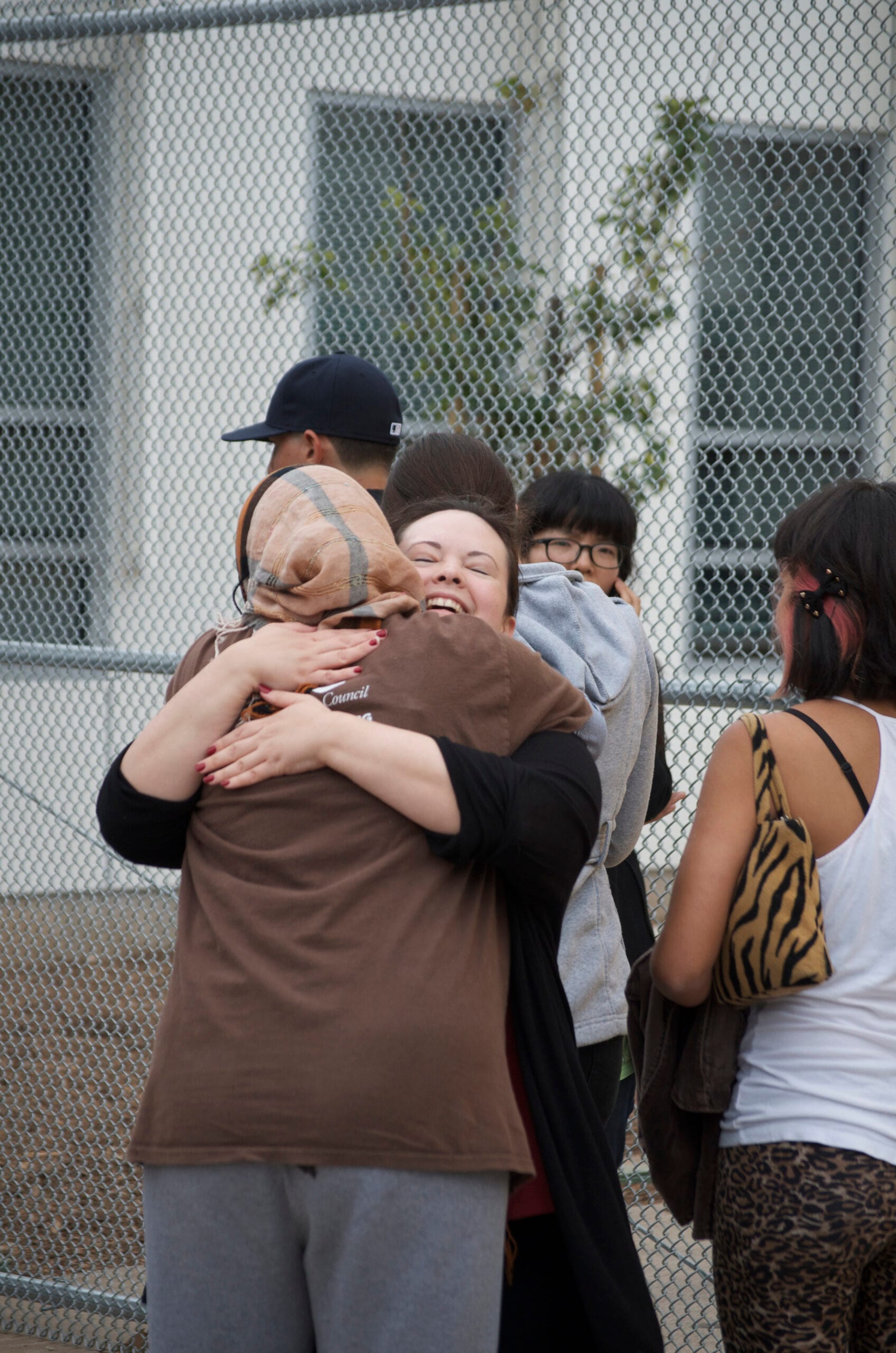 Two women hug after the shooting Friday afternoon at Santa Monica College.