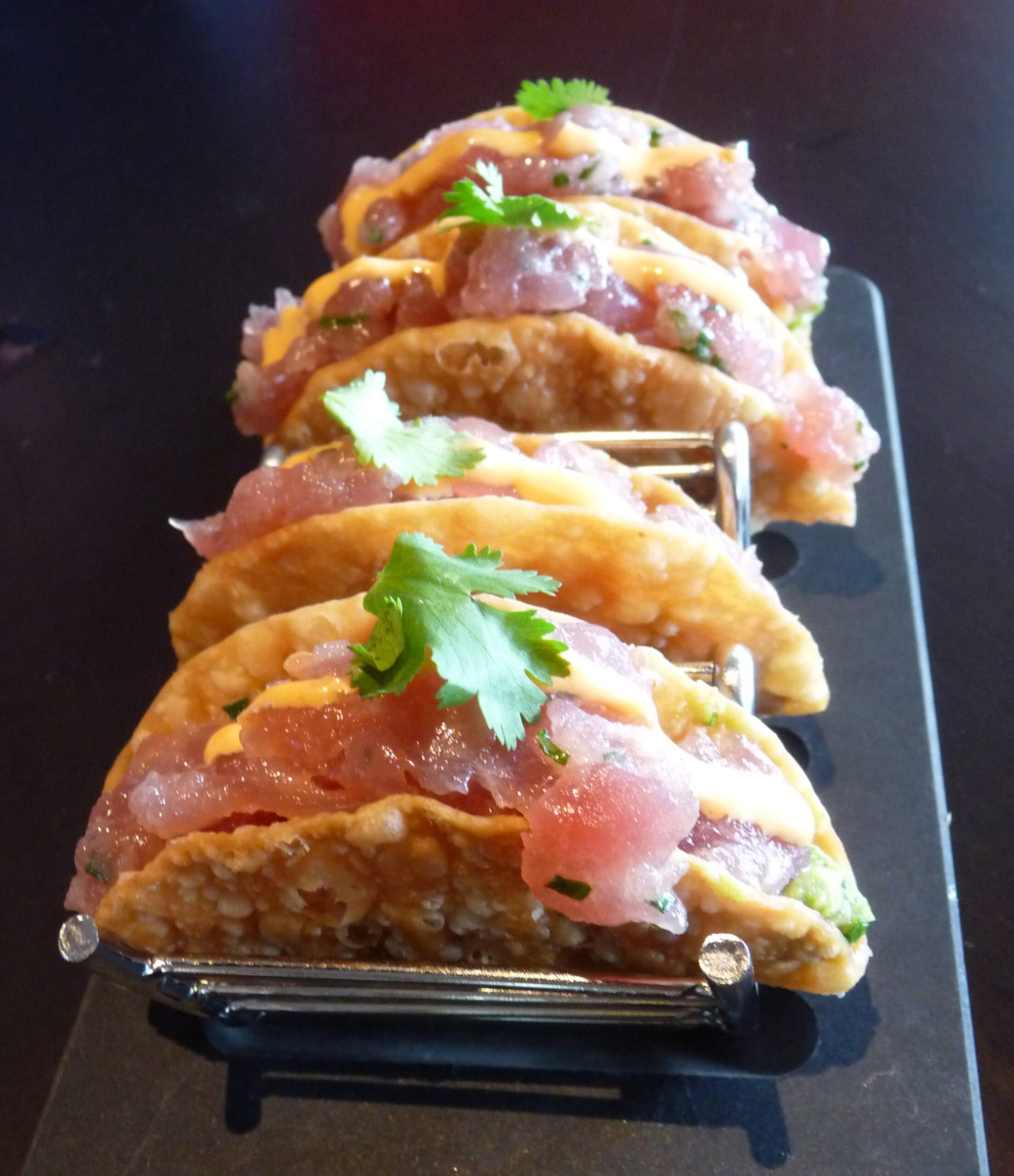 Del Frisco's Grille serves up ahi tuna tacos featuring fresh quacamole in a crunchy, fried wonton shell. 