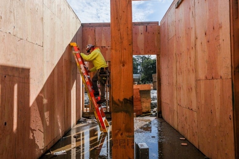 Framers work to build the Ruby Street apartments in Castro Valley on Feb. 6, 2024. The construction project is funded by the No Place Like Home bond, which was passed in 2018 to create affordable housing for homeless residents experiencing mental health issues. Photo by Camille Cohen for CalMatters