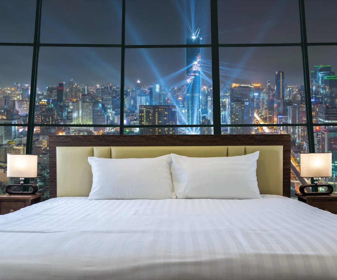 Luxury suite overlooking a night skyline