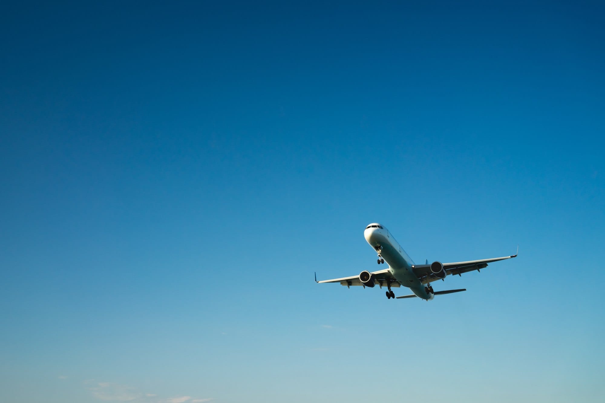 Airplane Taking Off into a Clear Blue Sky