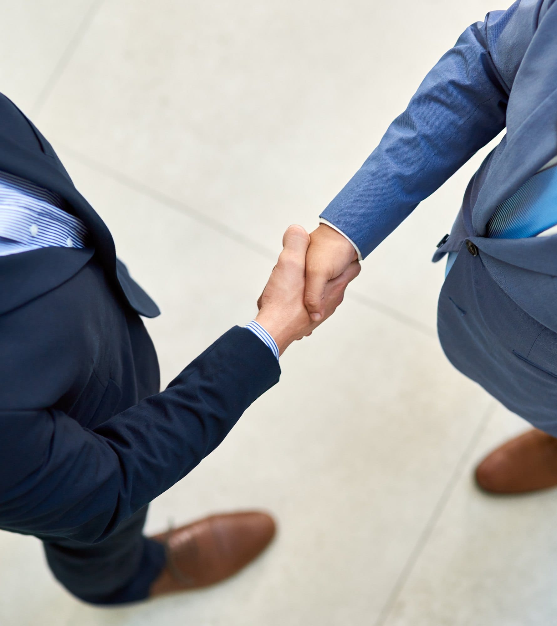 Business People Handshake in Agreement to Partnership