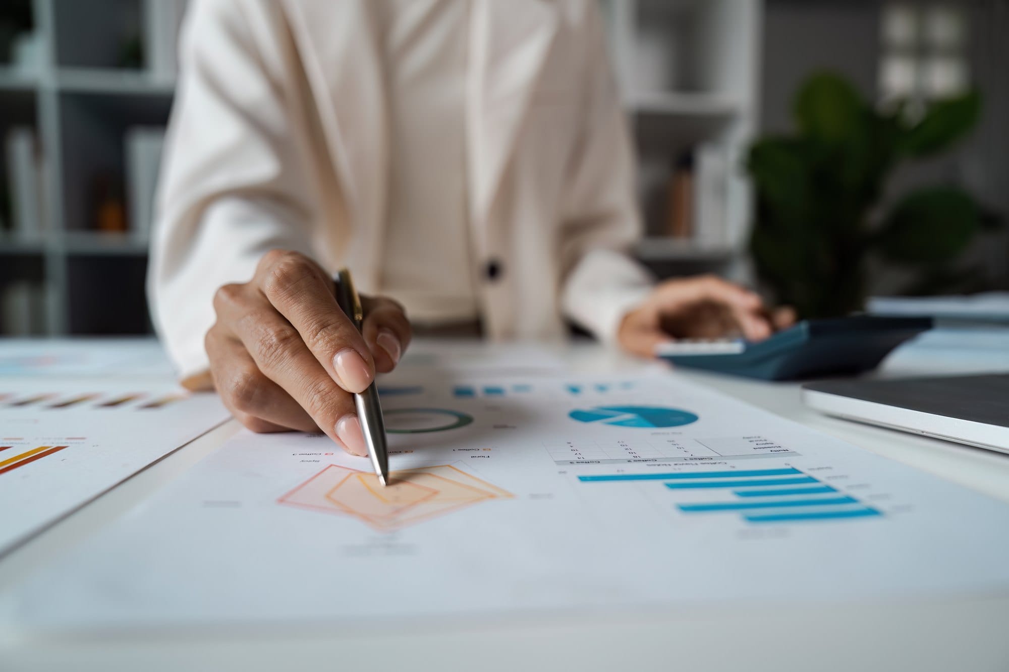 Business Professional analysis Financial Data with Graphs and Charts in Modern Office Setting