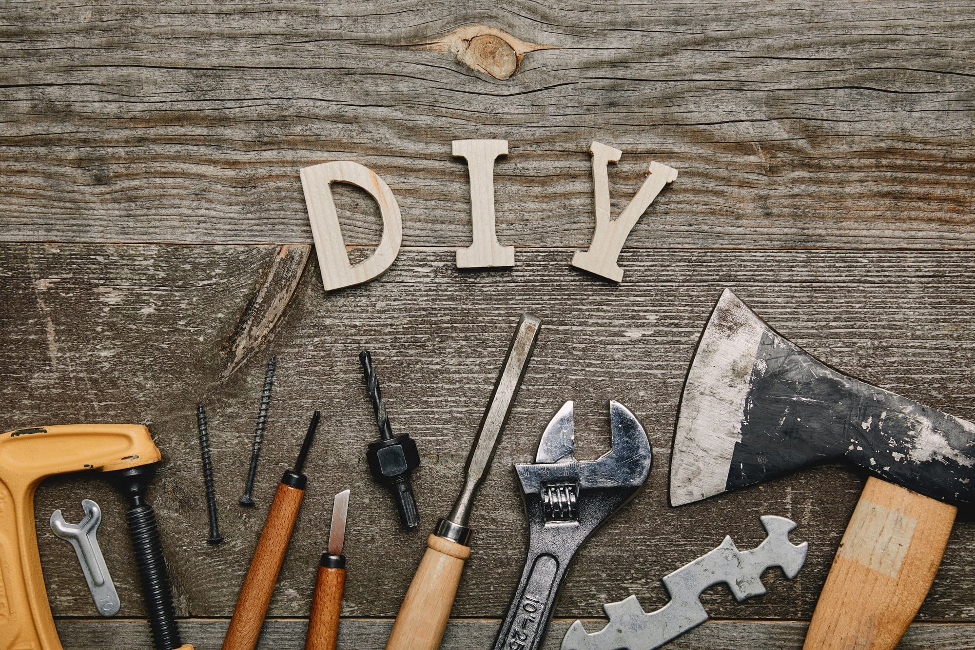 DIY Concept with Tools on Wooden Background