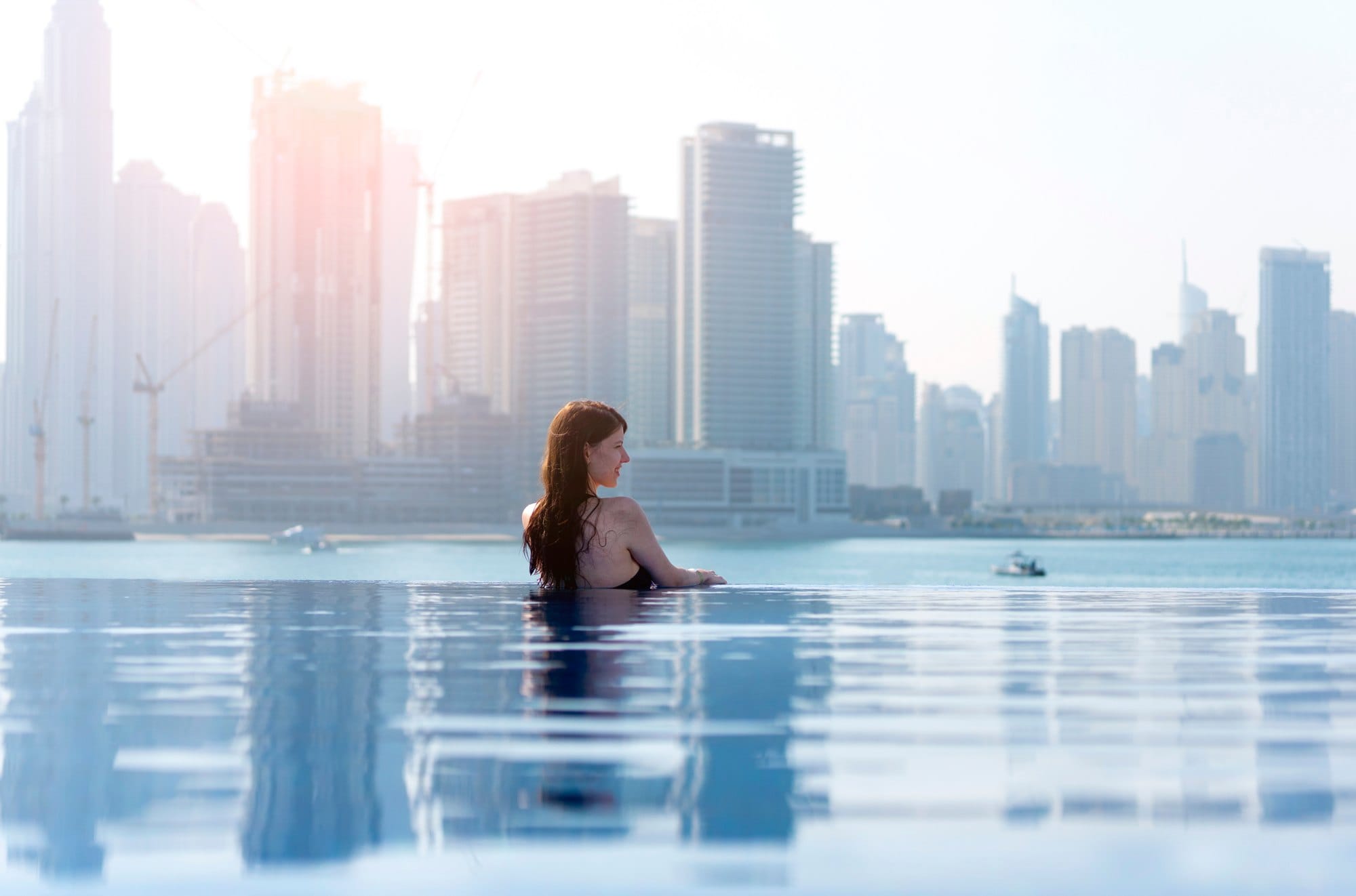 Dubai infinity pool on a palm Jumeirah with a skyscraper view