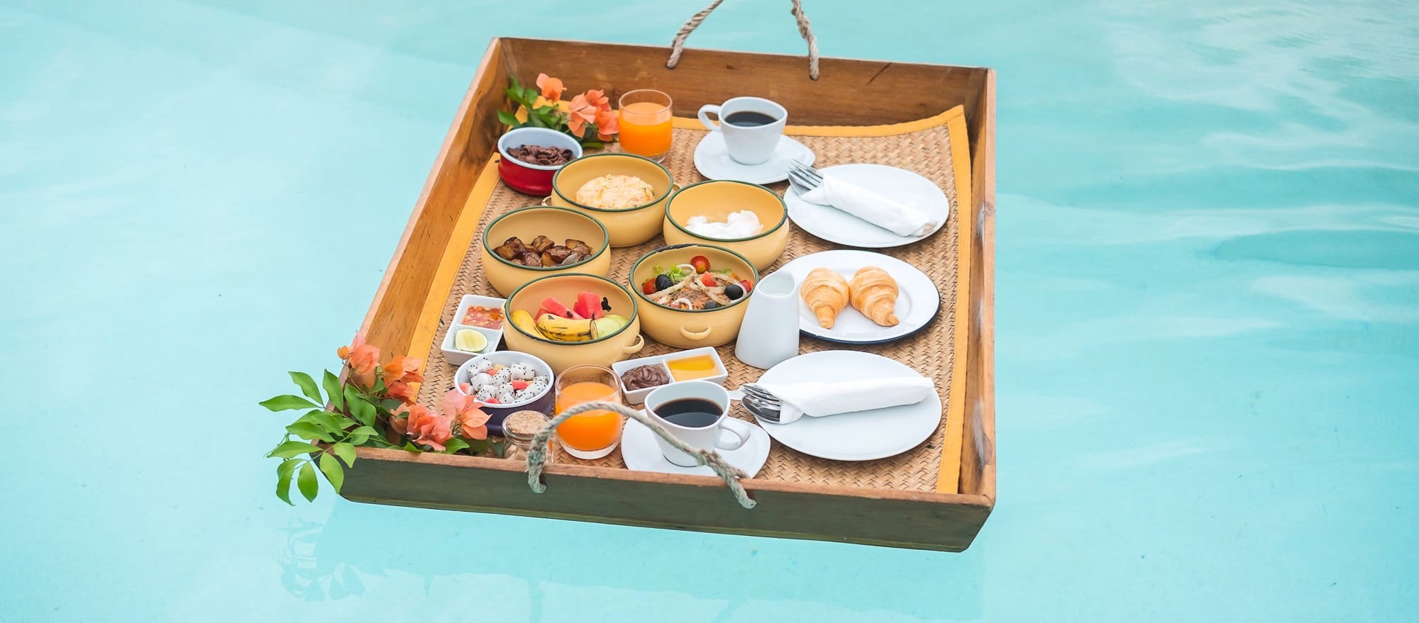 Floating Breakfast tray in swimming pool at luxury hotel or tropical resort villa