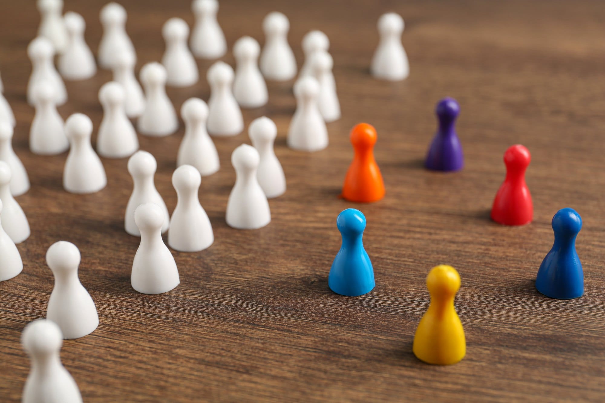 Group of Colorful Game Pieces on Wooden Surface