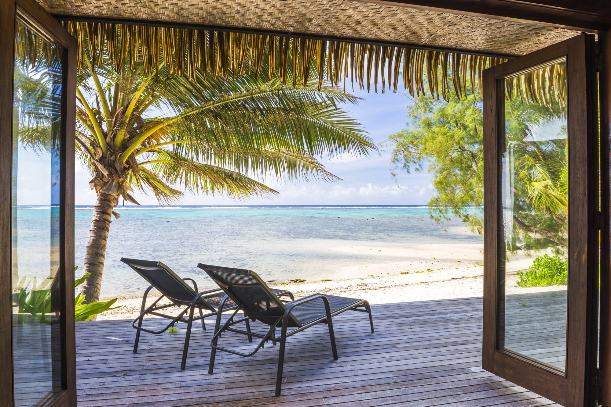 Luxury Villa accommodation with sea views of the tropical Pacific ocean and palm trees, Muri, Raroto