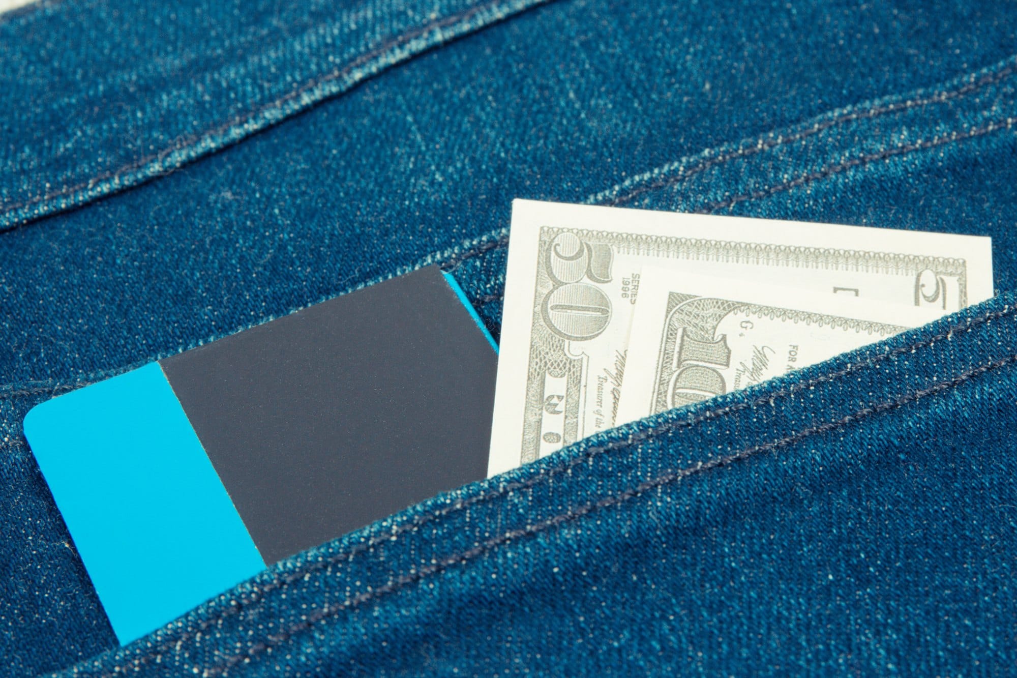 Money and Credit Card in Jeans Pocket