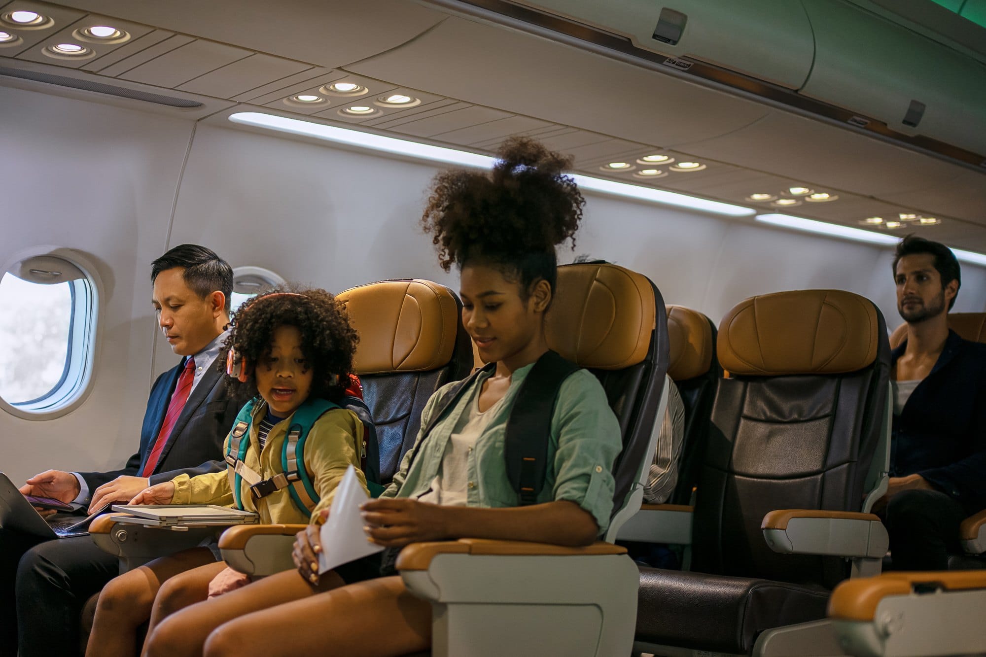 People Riding on Airplane Seats Traveling Together