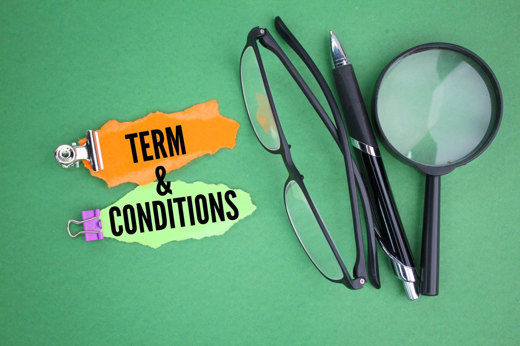 Terms and Conditions with Magnifying Glass and Pen
