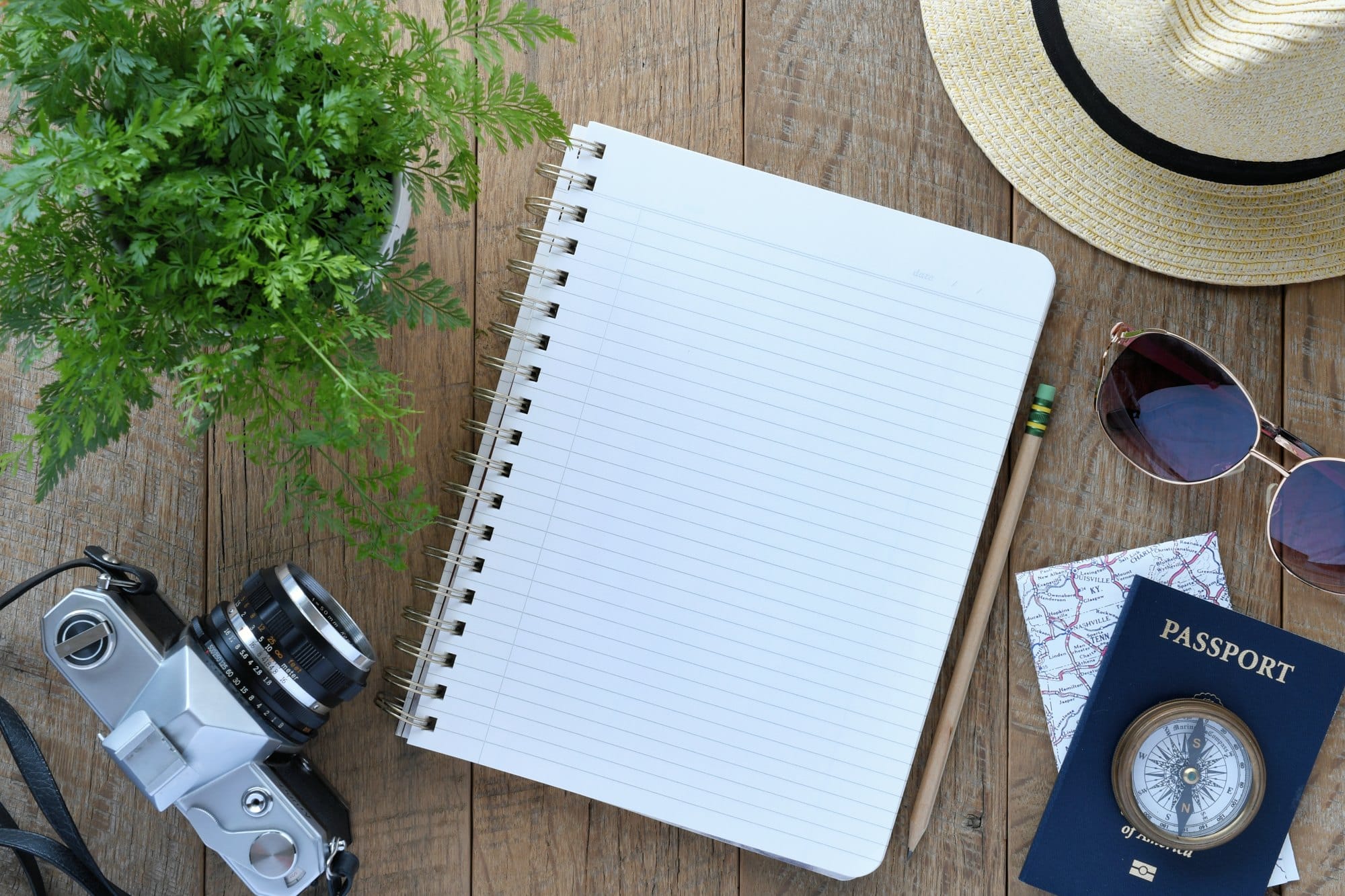 Travel Planning Flat Lay With Passport and Camera