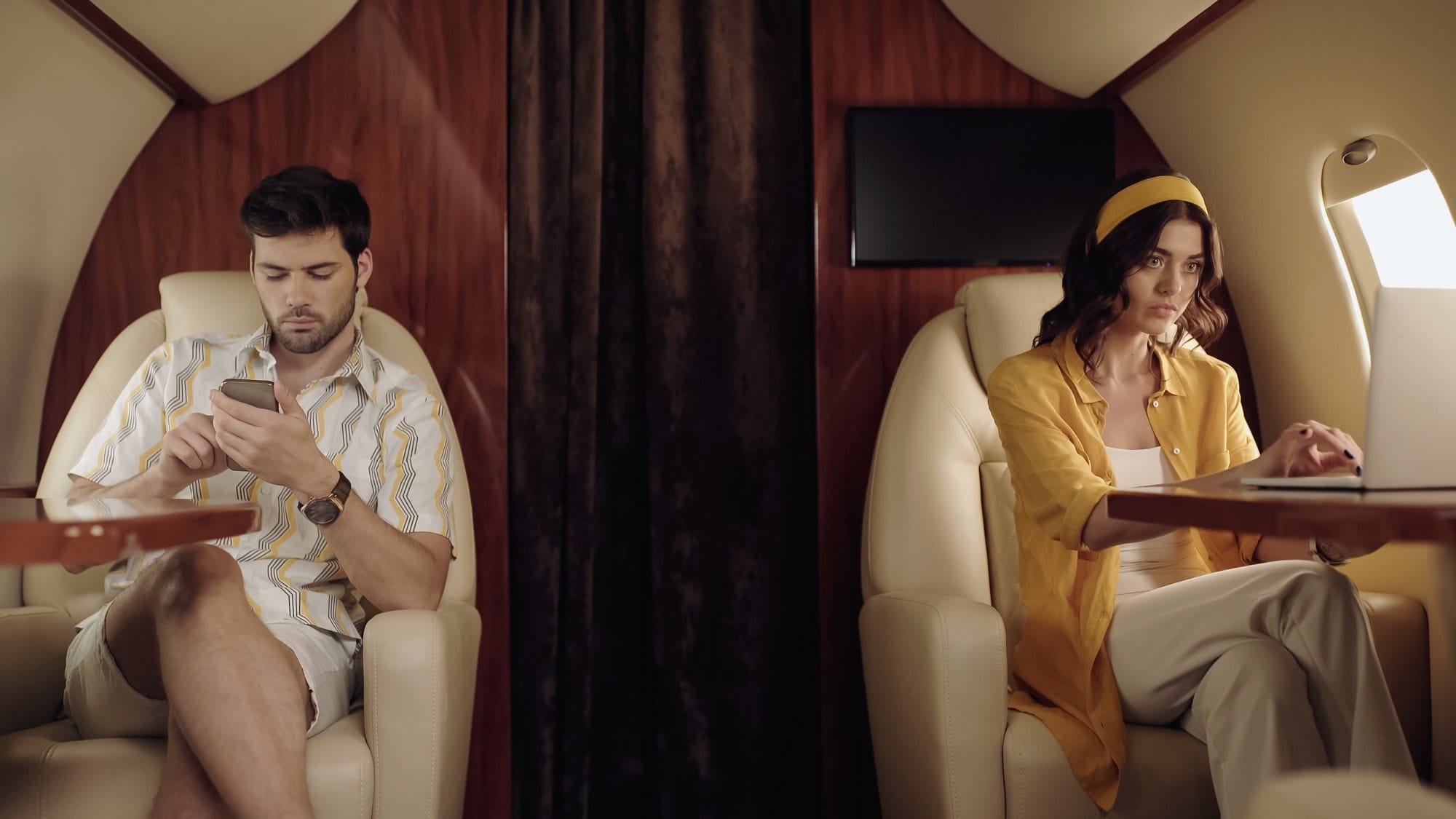 Travelers relaxing on private plane together