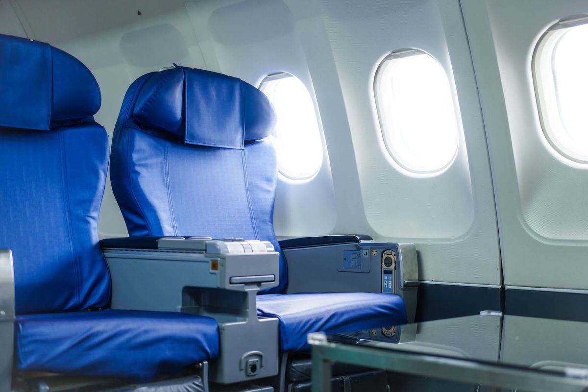 A modern airplane seat with a window view, perfect for business or leisure travel