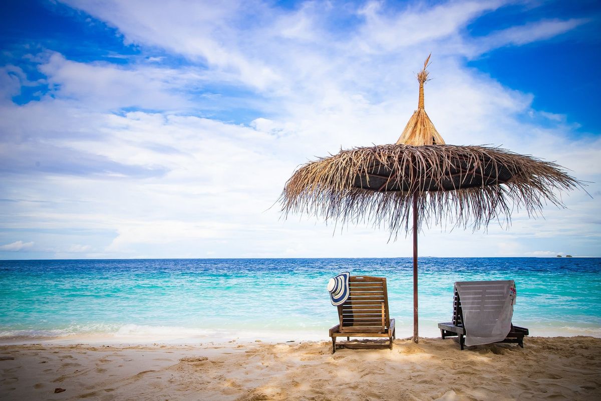 Beach chairs on beautiful tropical beach