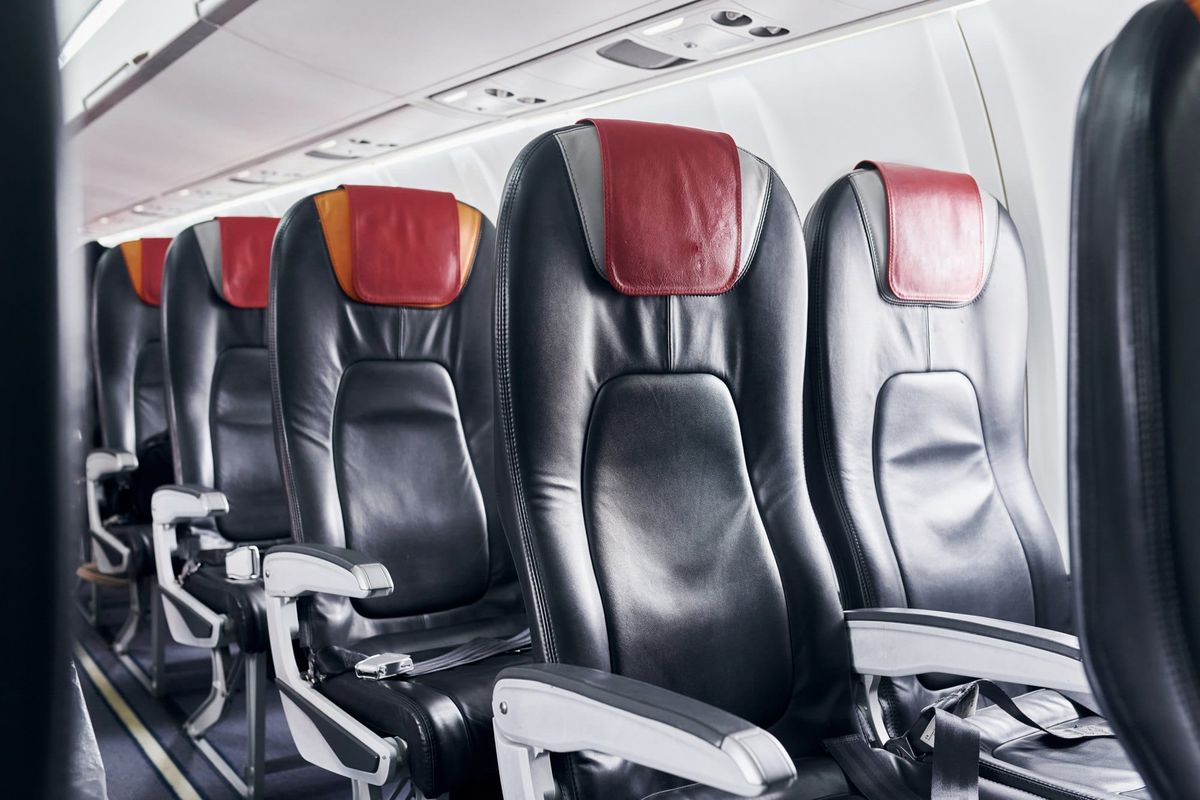 Airplane Interior with Black Leather Seats and Headrests