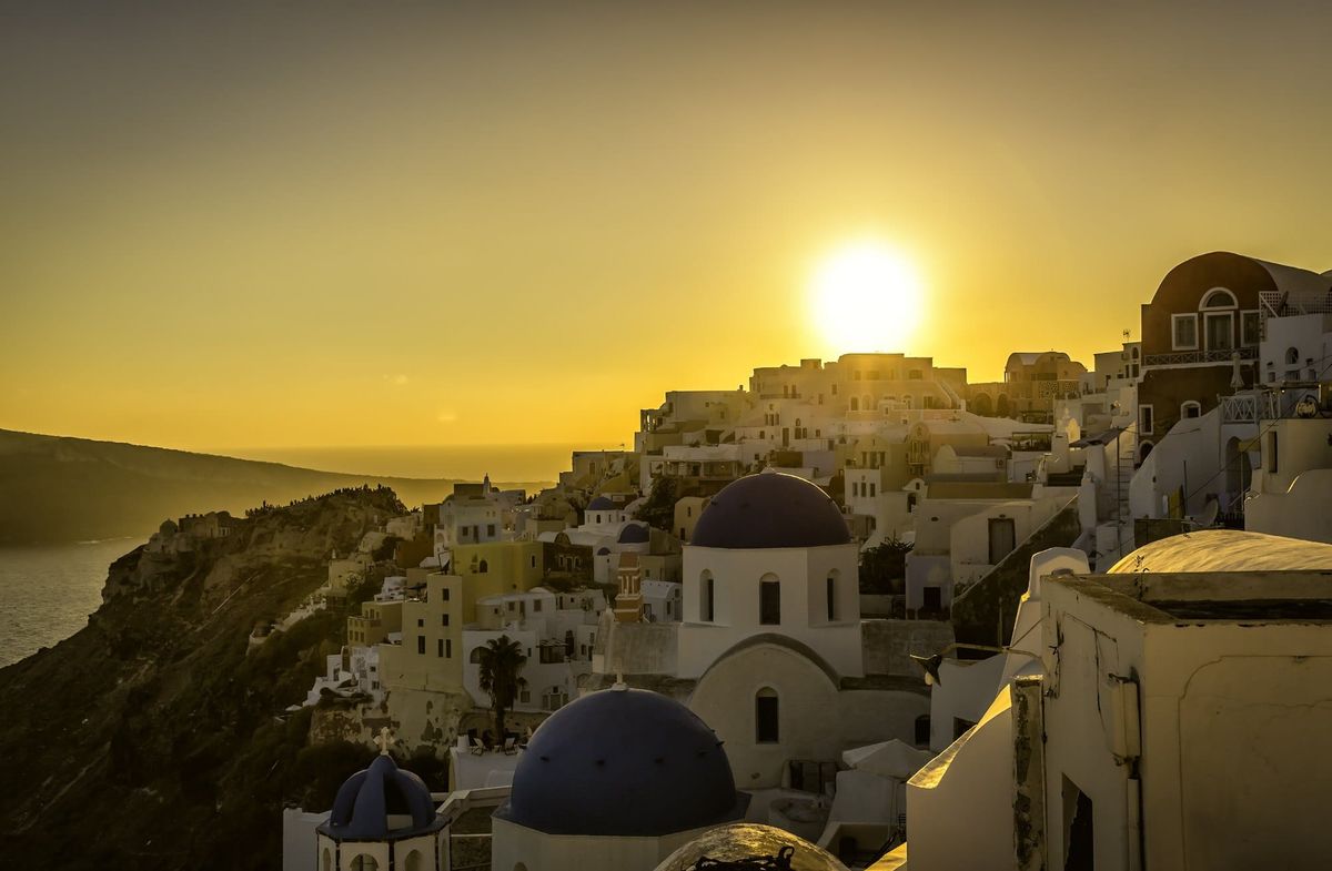 Sunset View Of The Blue Dome Churches Of Santorini, Greece