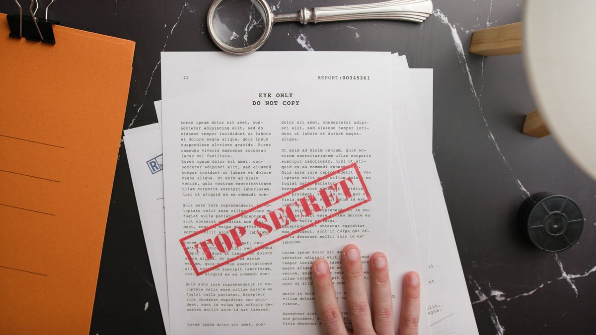 Top Secret Documents on Dark Marble Desk