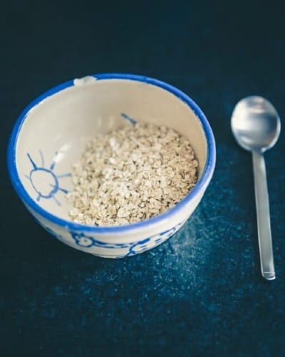 cereals in blue and white ceramic bowl