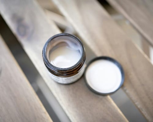 silver ring on brown wooden table
