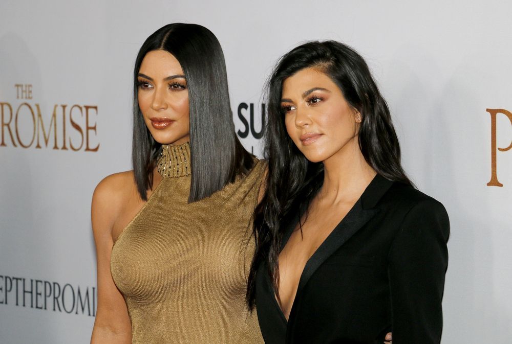 Kourtney Kardashian and her sister Kim