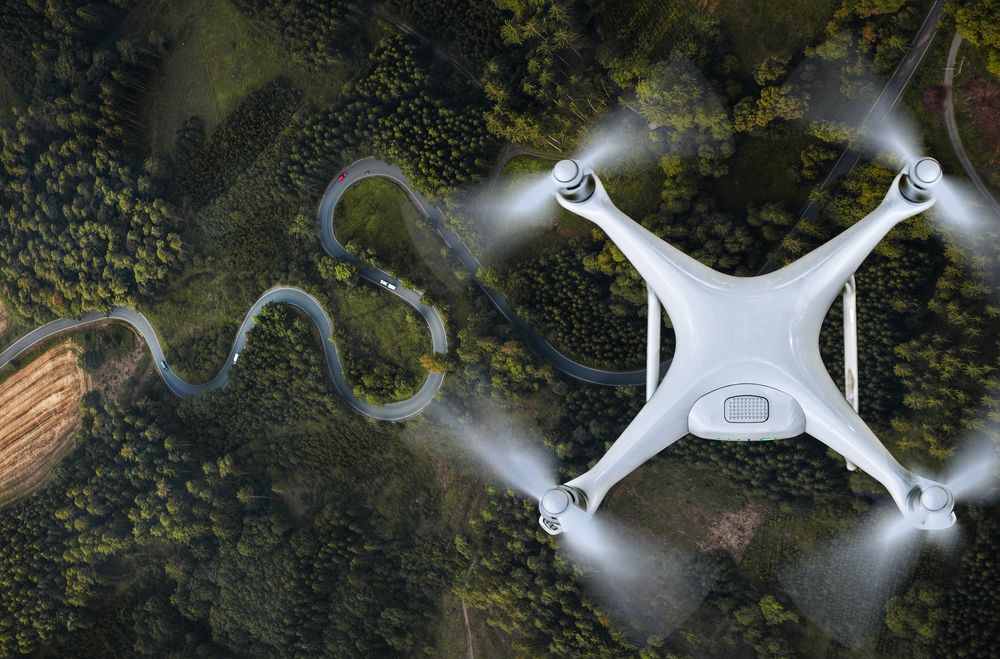 Drone flying above forest
