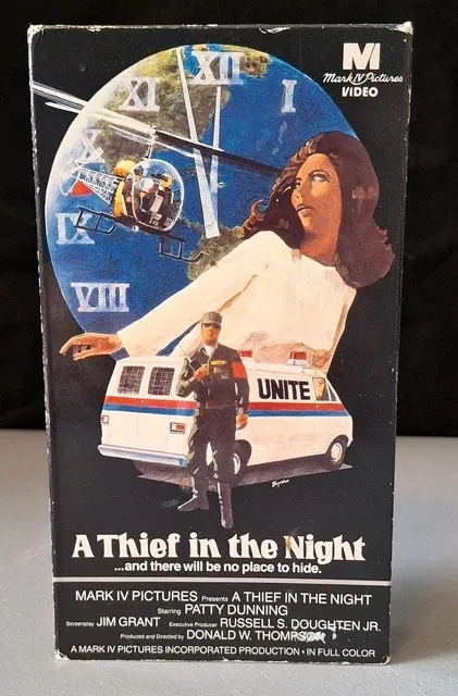 a VHS tape with a pictures of a globe, a helicopter, a van, a soldier and a woman.Text reads: A Thief in the Night...and there will be no place to hide.
