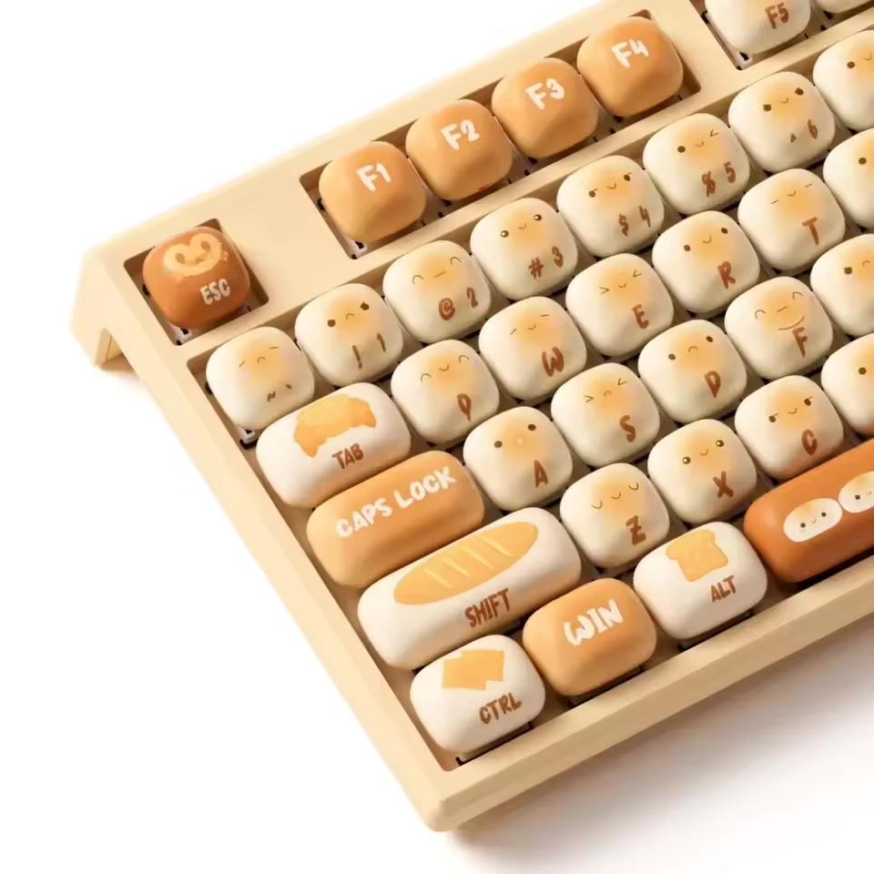 A keyboard with keys that look like loaves of bread with faces.