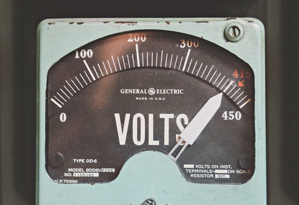 A photo of a vintage volt meter. 