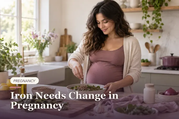 A pregnant woman preparing lentils and spinach in a bright kitchen.