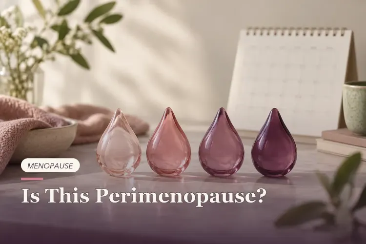 Glass objects changing from rose to plum beside a blank calendar.