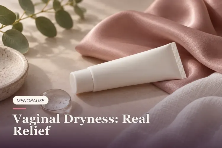 An unbranded moisturizer tube beside a clear gel drop and soft rose-colored fabric.