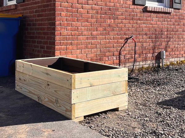 Sometimes gardening looks like painting and building