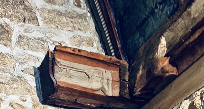 A wood frame on a brick wall

AI-generated content may be incorrect.