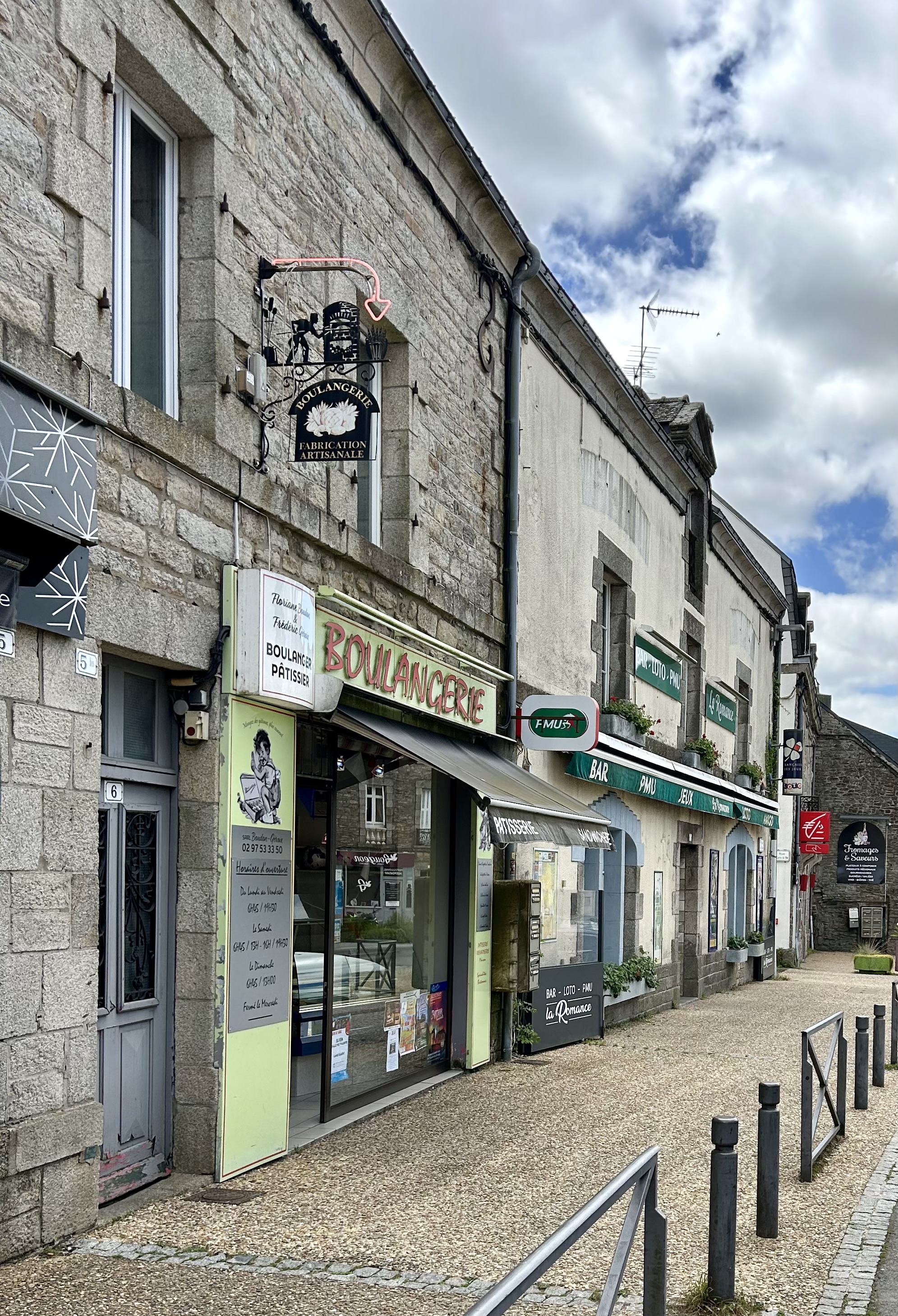 A building with a sign on the front

Description automatically generated