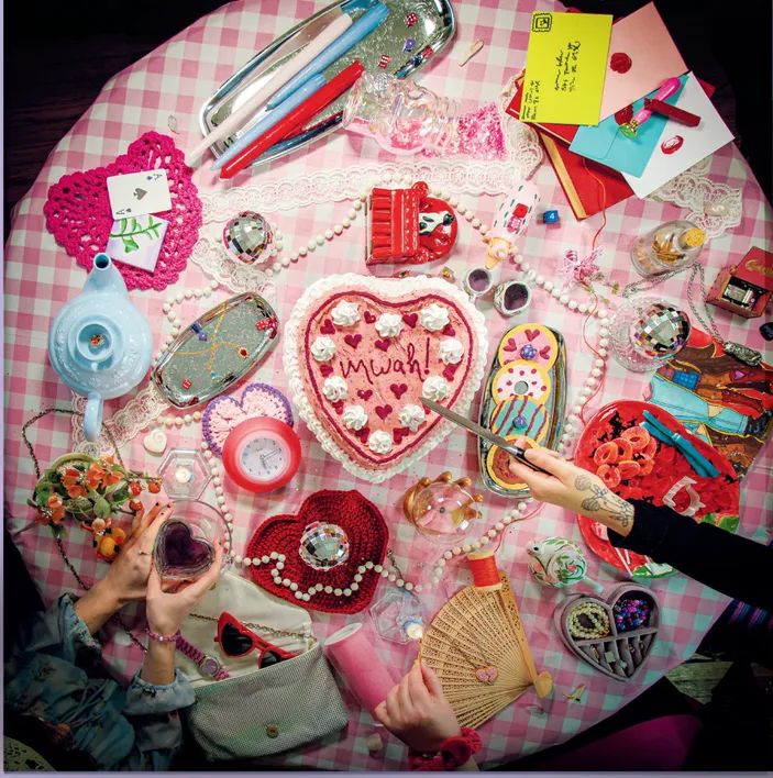 A pink maximalist cover design of the "mwah!" CD