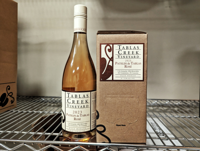 Boxed wine next to a bottle