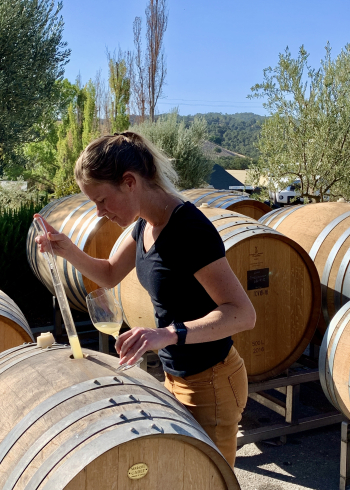 Chelsea tasting Roussanne from barrel vertical