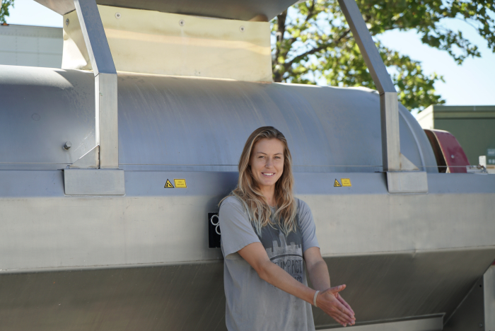 Josie leaning against a press
