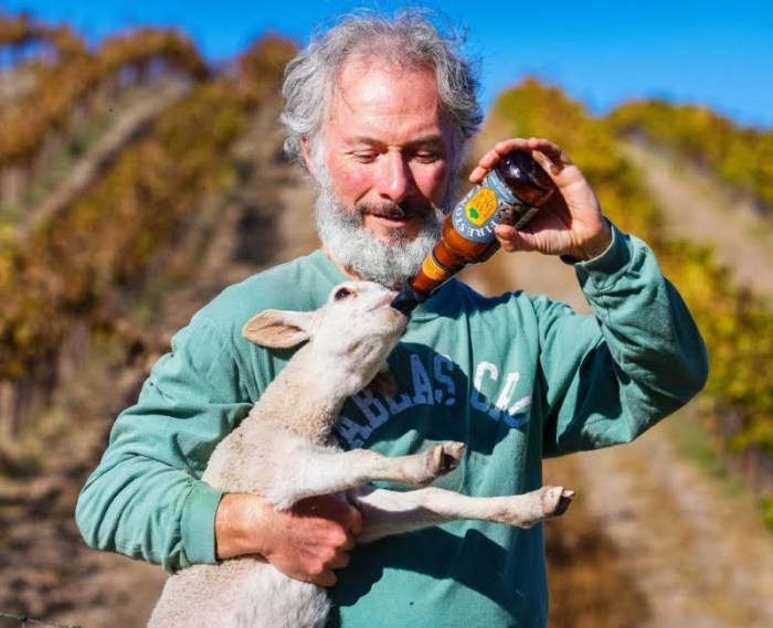 Gustavo feeding lamb