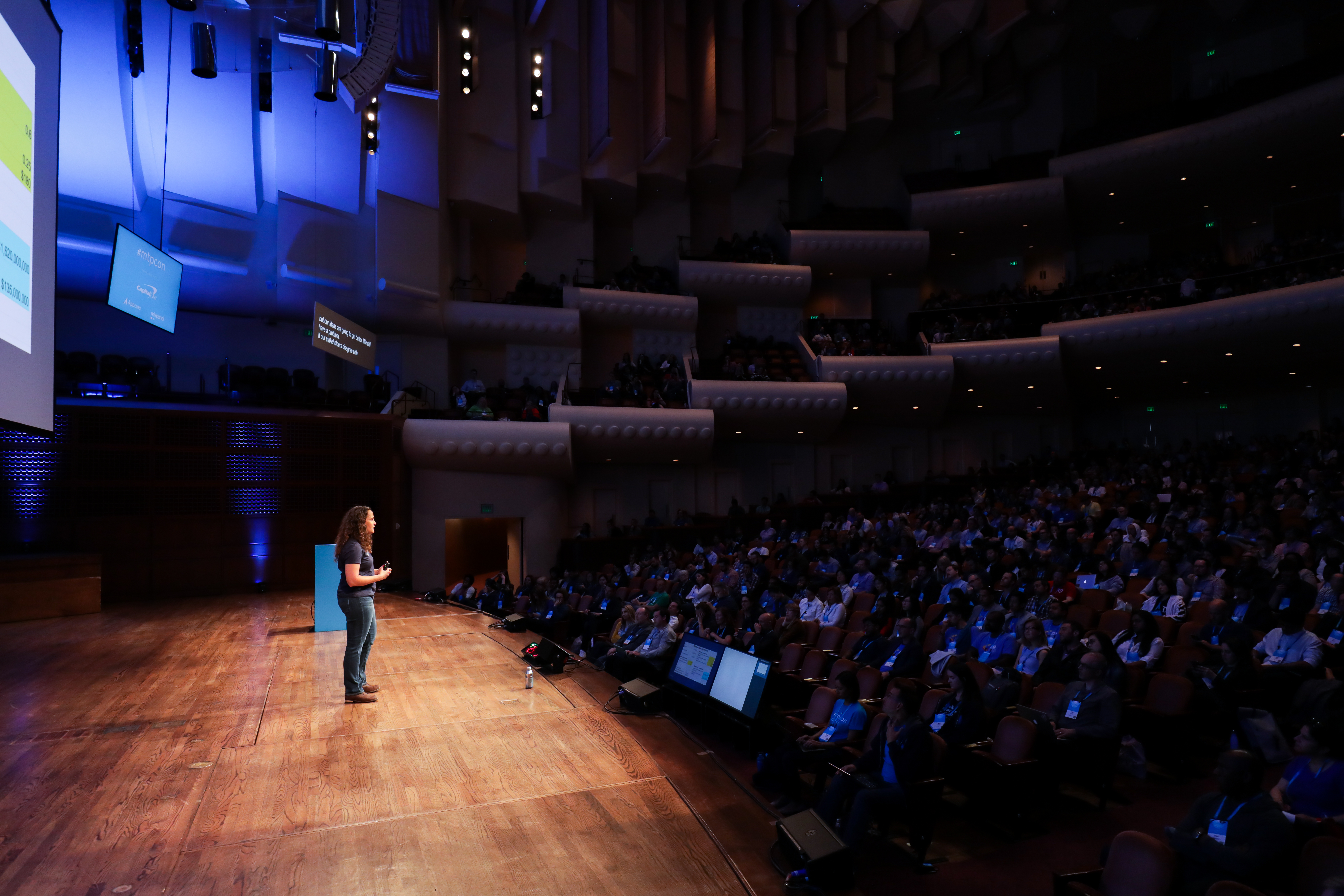 Teresa speaking to a large audience