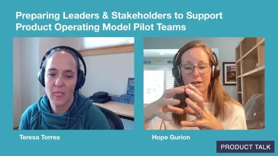 A video still of Teresa Torres and Hope Gurion discussing how to prepare leaders and stakeholders to support product operating model pilot teams. Teresa and Hope are shown side-by-side on a teal background, each wearing headsets, with the Product Talk logo in the bottom right.
