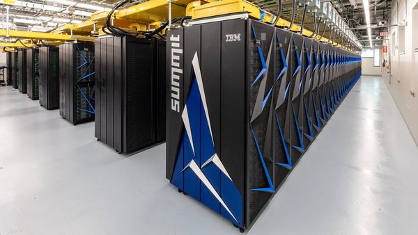 Rows of IBM-built Summit supercomputer cabinets in the machine room at Oak Ridge National Laboratory.