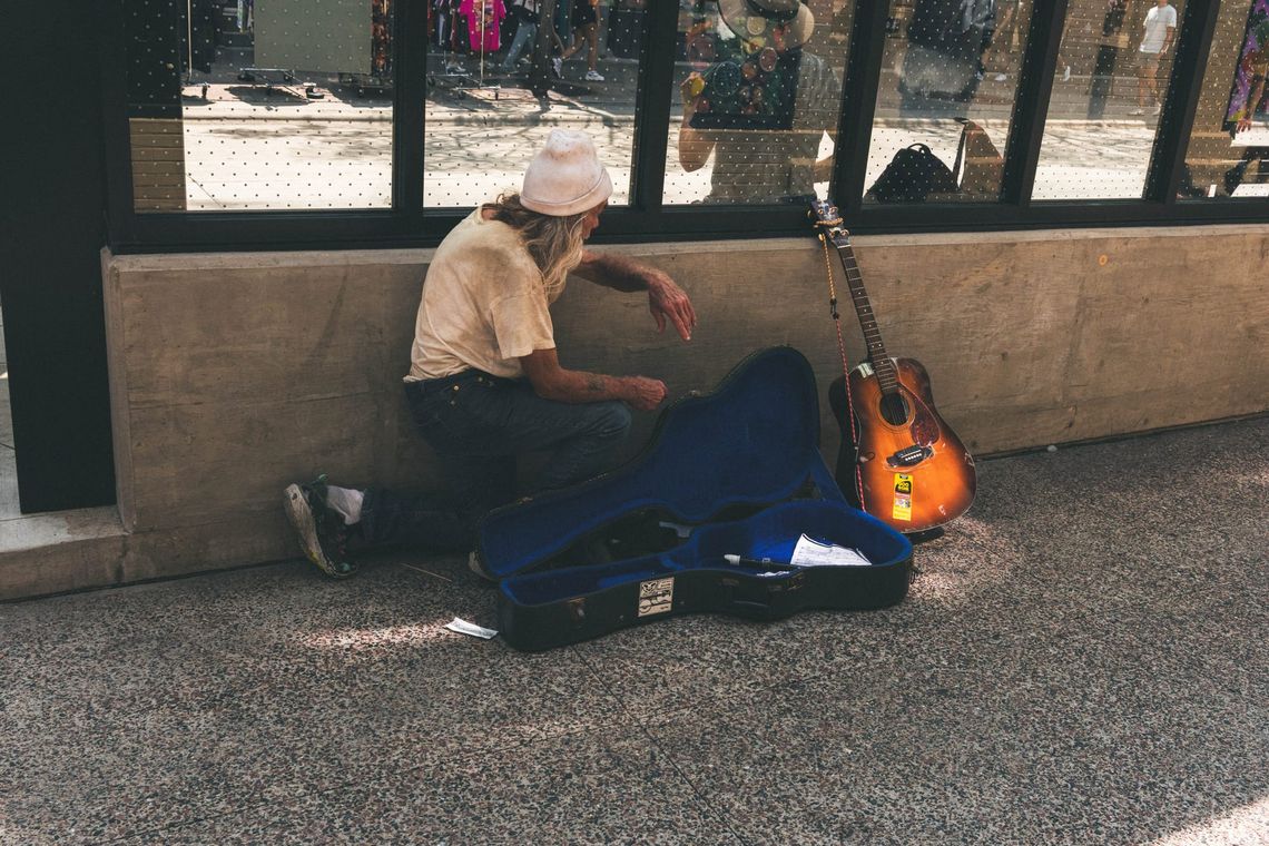 "Man and Guitar, Kneeling"