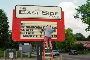 "Man Changing Marquee"