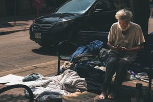"Man on Bench, Contemplating"