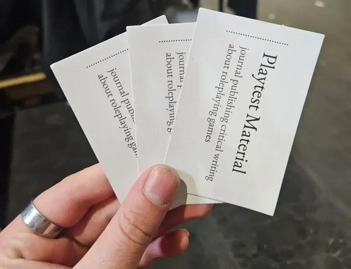 An image of the editor giving out business cards for the magazine at UK Games Expo (2026)