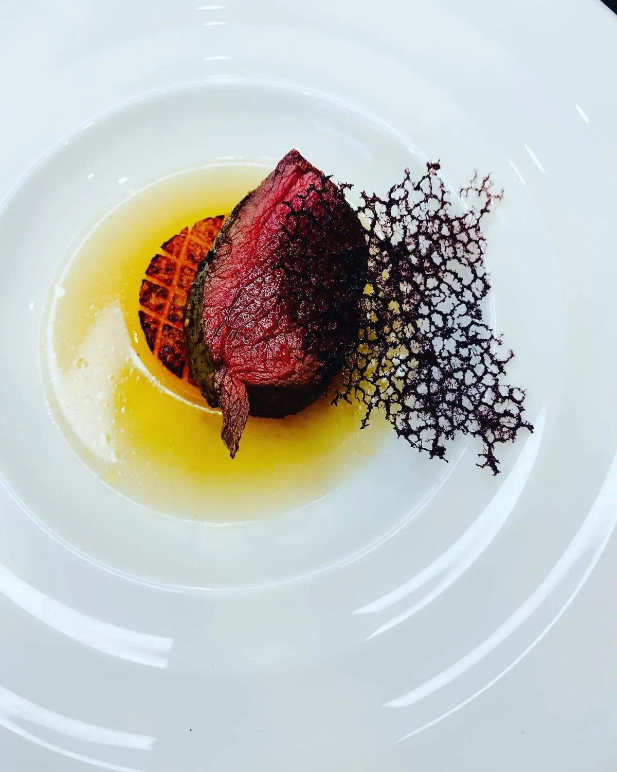Roasted beet finished with a delicate lattice tuile